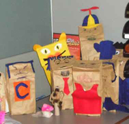 A bunch of puppets, mostly of the paperbag variety.