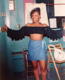 Clothed woman in a bookstore. She's showing off fo the camera.